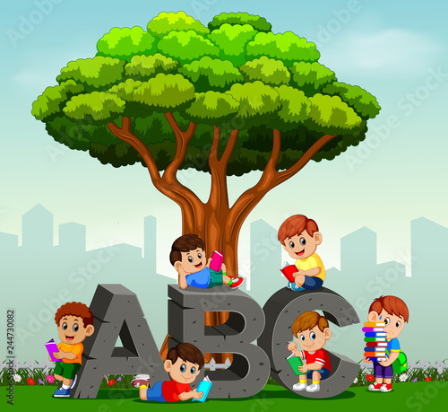 kids reading books in park