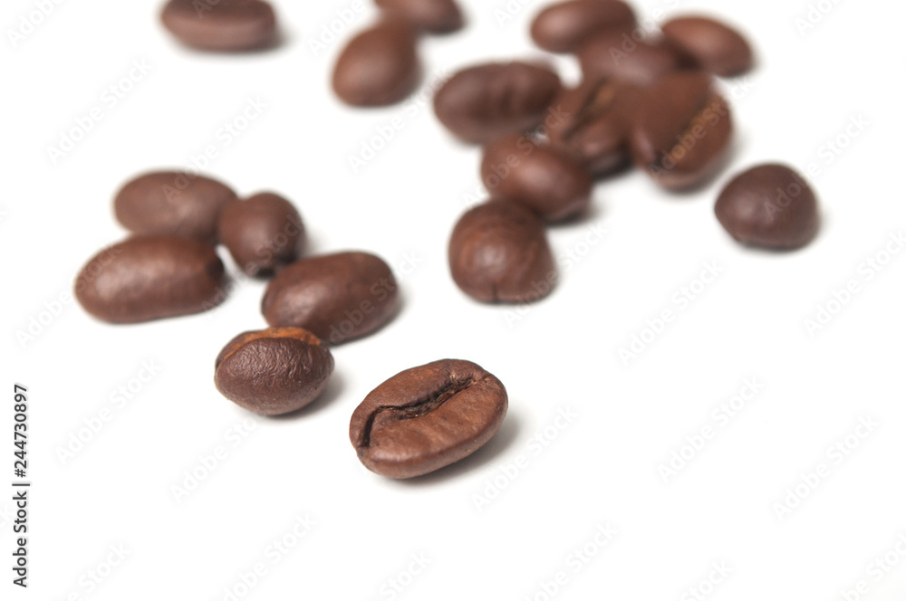 closeup of coffee beans on white background closeup of coffee beans on white background