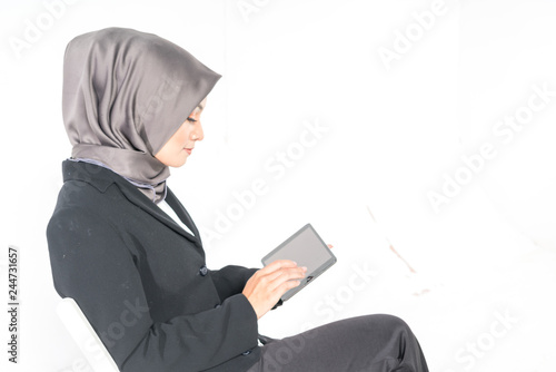 hijab student and tablet with white background.
