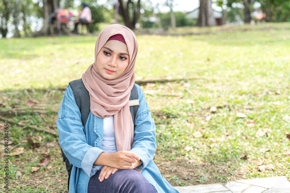 Veiled teenager at outdoor park. Veiled teenager at outdoor park.