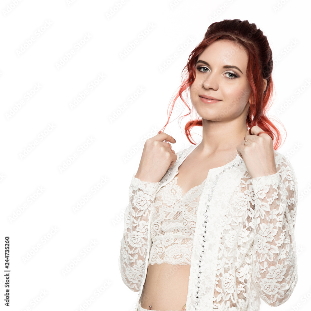 cheerful redhead girl in a transparent blouse with curly hair smiling on a white background. free space for your text cheerful redhead girl in a transparent blouse with curly hair smiling on a white background. free space for your text