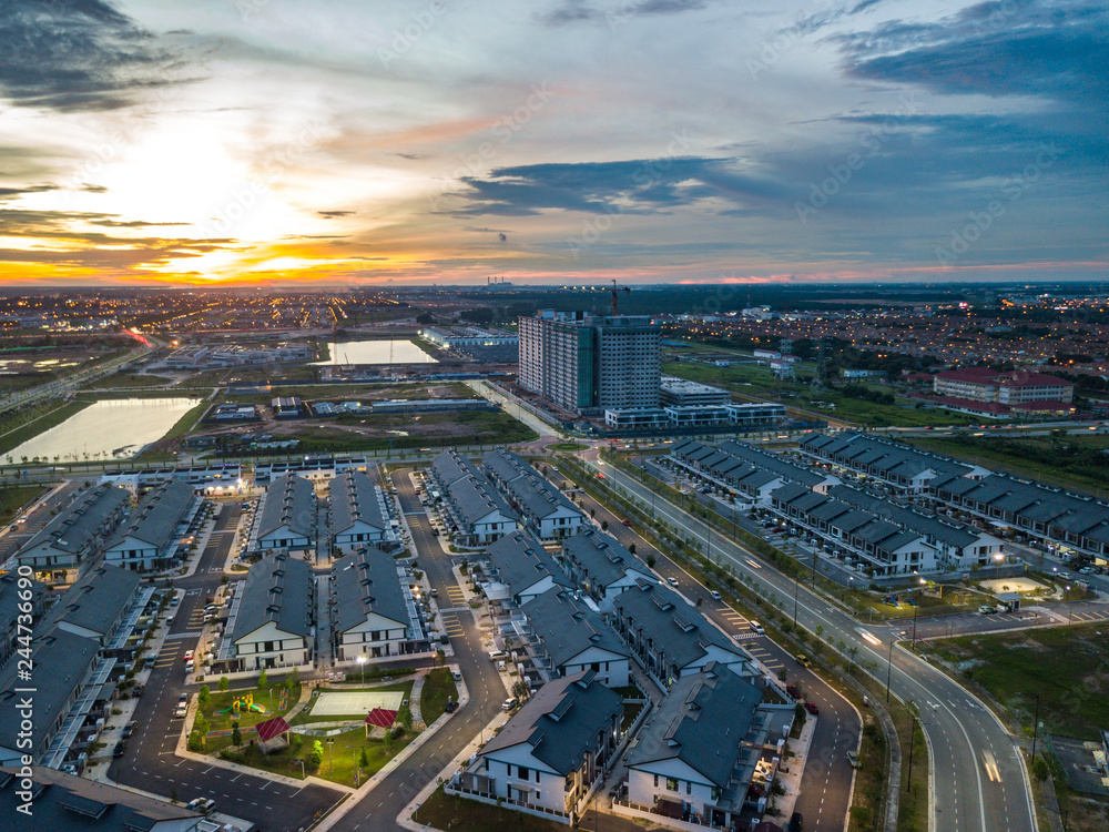 Aerial view of residential township during sunset.