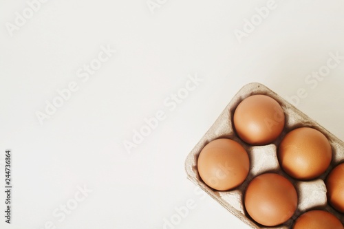 Eggs in tray on white background.