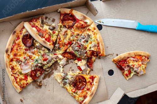 friends tasted a few pieces of delivered pizza and realized that it was tasteless and spoiled poisoned and and did not eat it and left it in the box