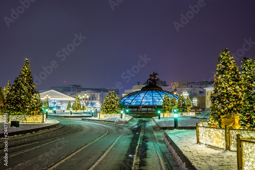 Manezhnaya square with the Christmas decoration in winter night. Moscow, Russia.