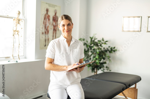 A Modern rehabilitation physiotherapy woman worker at job photo