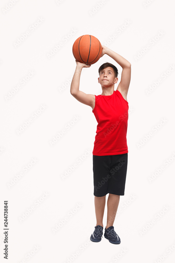 Sporty boy with basketball ball