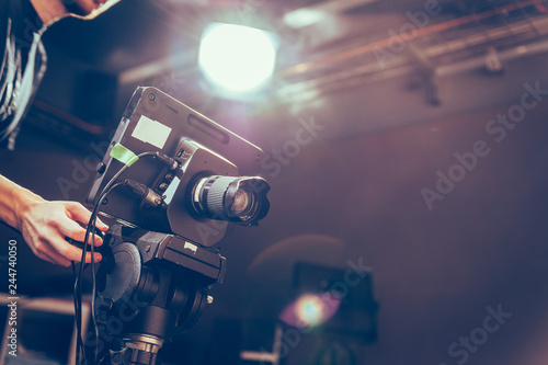 Cameraman operates a film camera, broadcasting studio