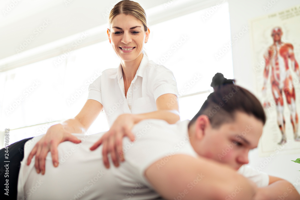 Fototapeta premium A Modern rehabilitation physiotherapy woman worker with client