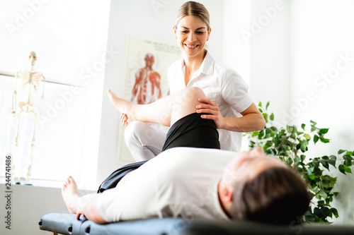A Modern rehabilitation physiotherapy woman worker with client