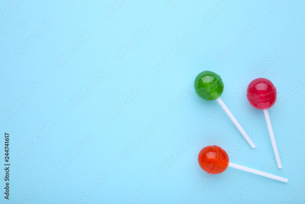 Lollipops on blue background. sweet candy concept Lollipops on blue background. sweet candy concept