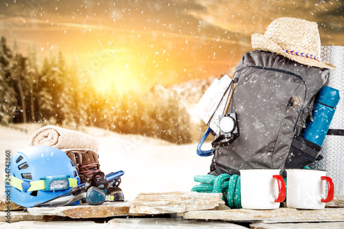 Winter time and backpack on stone. Free space for your decoration. 