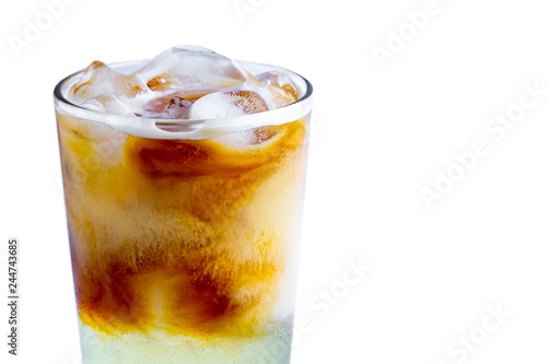 Isolated glass of cold cocktail with ice cubes on a white background. Cold drinks 