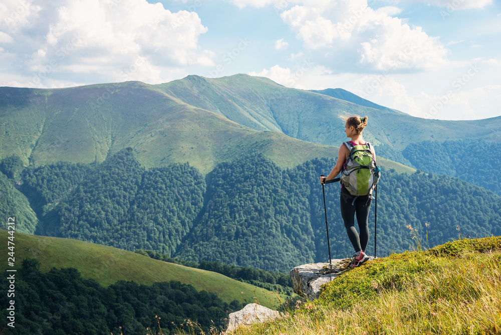 Young woman hiking in the mountains Young woman hiking in the mountains
