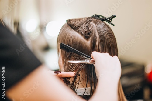 hairdresser makes hairstyle...