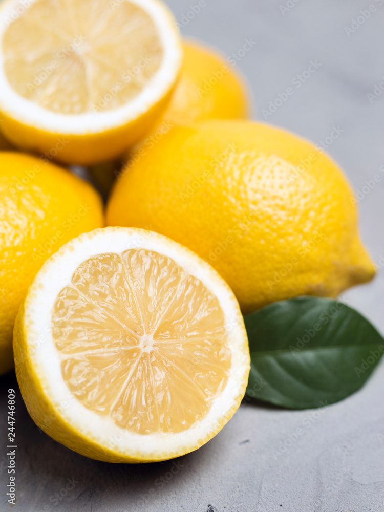 Lemons on gray stone background, copy space. Organic fresh citrus fruits Lemons on gray stone background, copy space. Organic fresh citrus fruits