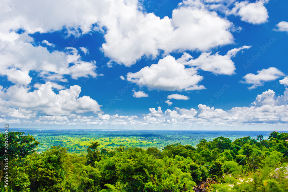 beautiful blue sky and clouds with green forest , sakon nakhon in thailand beautiful blue sky and clouds with green forest , sakon nakhon in thailand