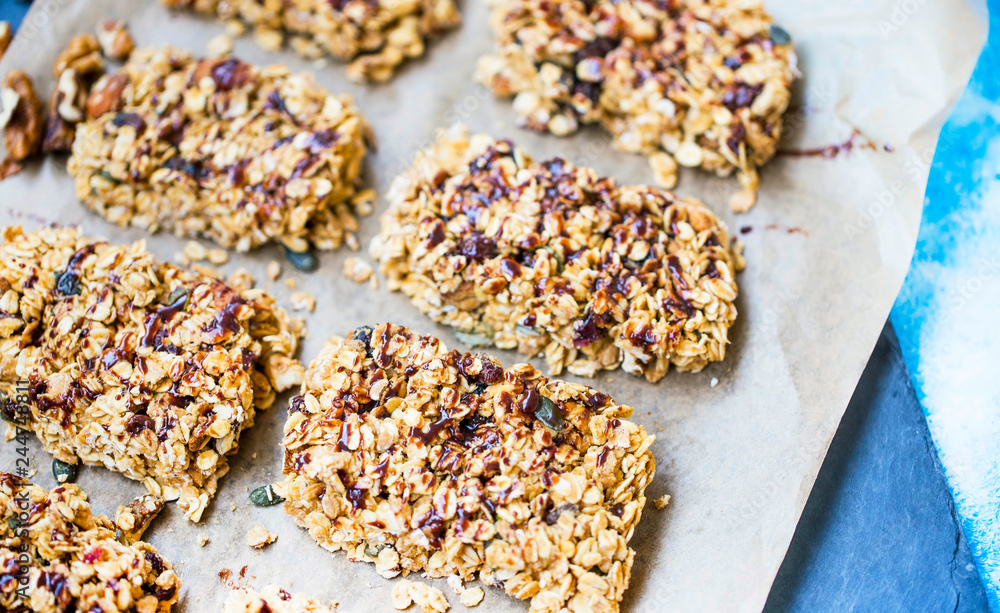 Homemade granola bars with oats, nuts, seeds and chocolate syrup Homemade granola bars with oats, nuts, seeds and chocolate syrup