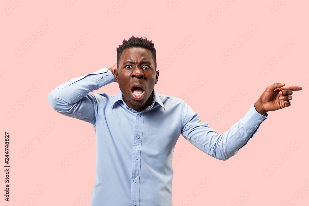 Wow. Attractive male half-length front portrait on pink studio backgroud. Young afro emotional surprised bearded man standing with open mouth. Human emotions, facial expression concept. Trendy colors Wow. Attractive male half-length front portrait on pink studio backgroud. Young afro emotional surprised bearded man standing with open mouth. Human emotions, facial expression concept. Trendy colors