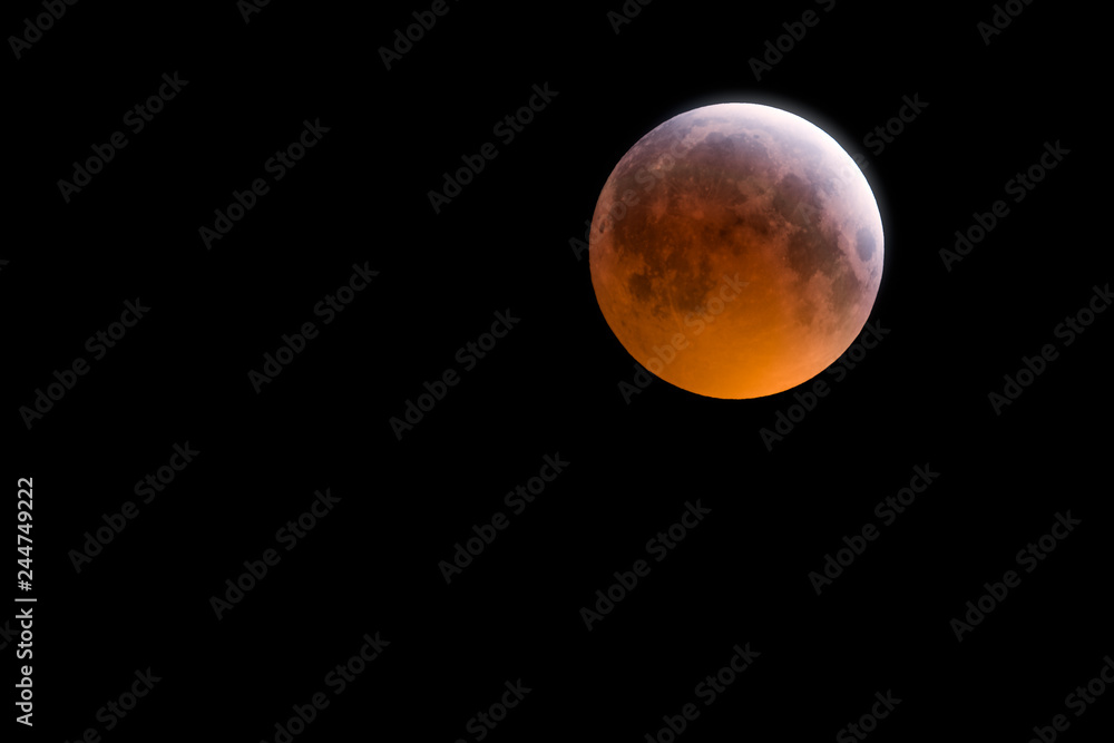 Obraz premium Lunar Eclipse at totality over Wales UK - aka 'Blood Moon