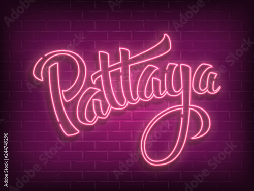 Pattaya lettering neon sign on brick wall background. Vector Pattaya city hand drawn typography logo. Vintage calligraphy design