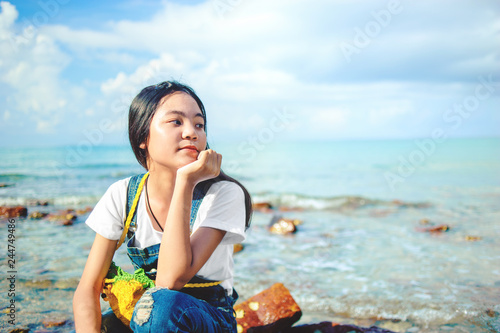 portriat of teenager asian girl on the beach photo