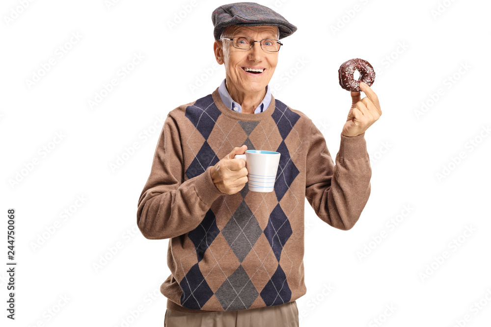 Cheerful senior man holding a chocolate donut and a cup of coffee Cheerful senior man holding a chocolate donut and a cup of coffee