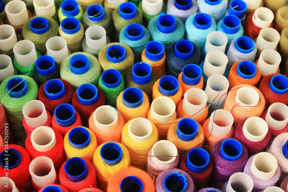 Multicolored bright spools of thread Multicolored bright spools of thread