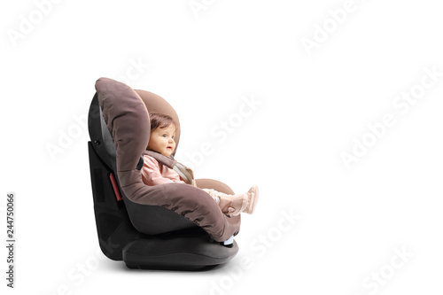 Tableau sur toile Baby girl strapped in a car seat