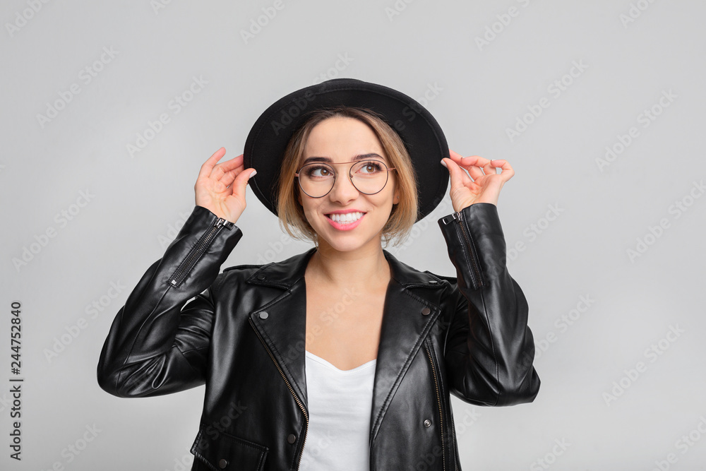 Fashion portrait of woman wearing black hat and jacket Fashion portrait of woman wearing black hat and jacket