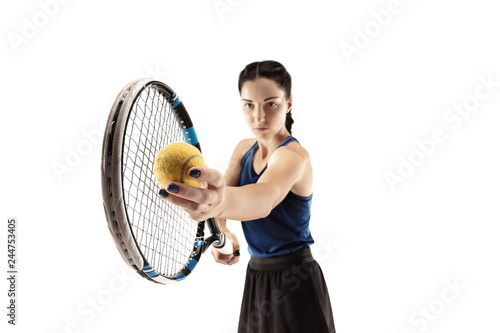Full length portrait of young woman playing tennis isolated on white background. Healthy lifestyle. The practicing, fitness, sport, exercise concept. The female model in motion or movement © master1305