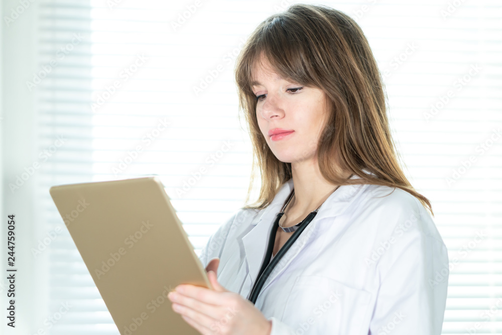 Female doctor using tablet computer Female doctor using tablet computer