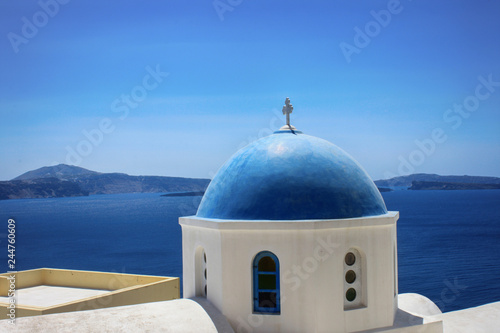 Beautiful view of the dome of the church and the sea on the island of Santorini in Greece