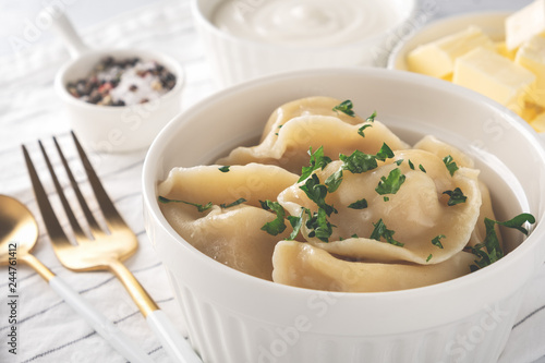 Traditional pelmeni, ravioli, dumplings with meat, close-up.