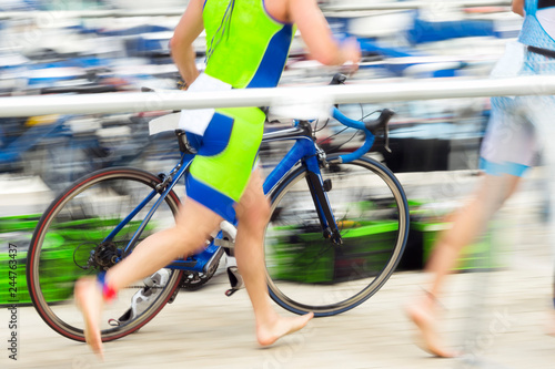 triathlon competitors in ciclyng , cyclist in action and motion photo