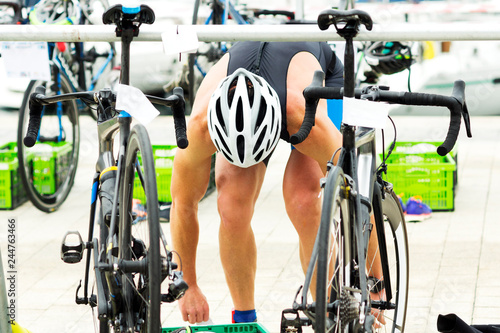 triathlon competitors in ciclyng , cyclist in action and motion photo