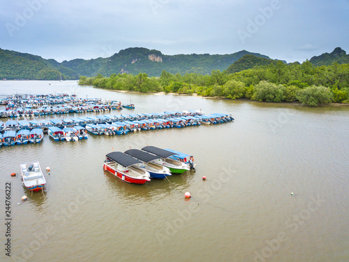 LANGKAWI, MALAYSIA - SEPTEMBER 15, 2017: Boats parking at jetty Tanjung Rhu Beach.