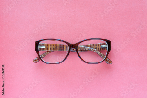women's glasses on a pink background