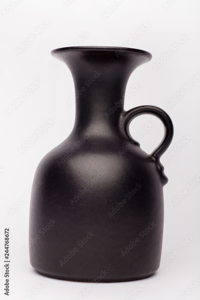 Old black vase  on the white background