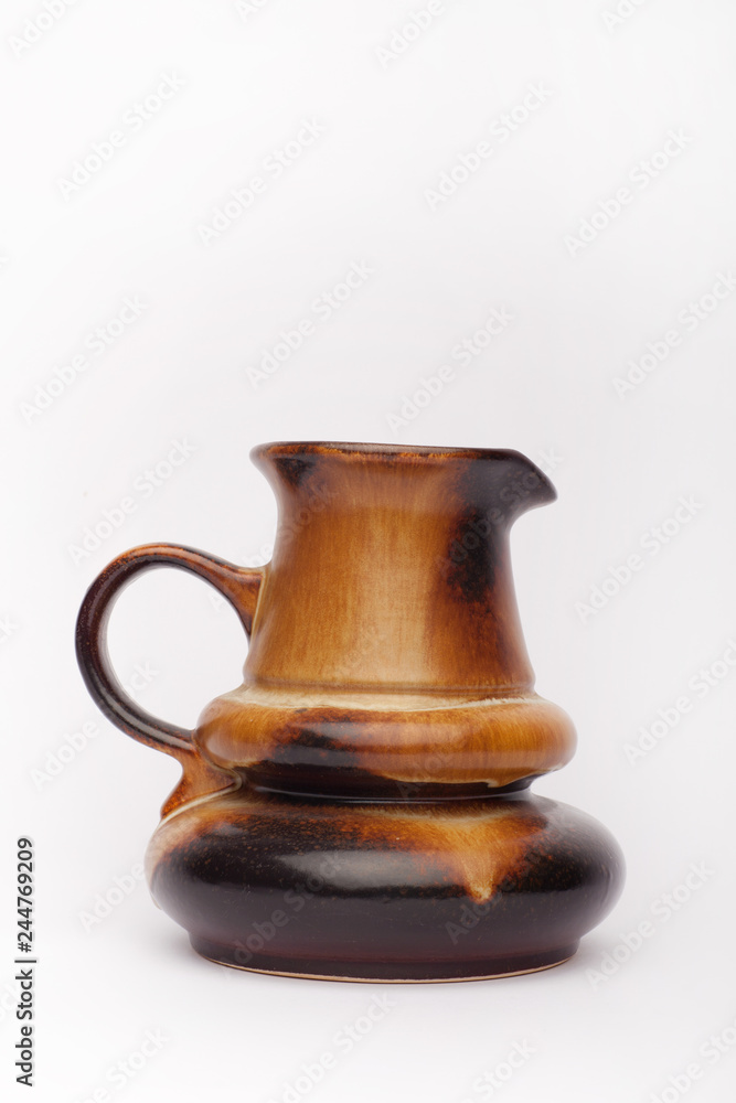 Old brown vase, teapot  on the white background