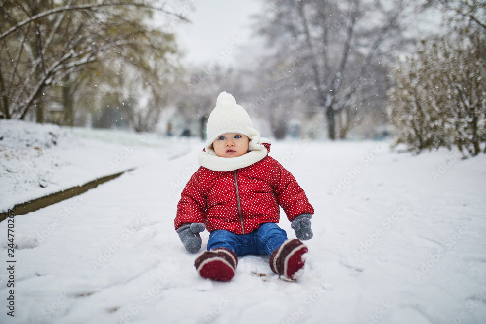 Baby girl in stroller in Paris on a day with heavy snow Baby girl in stroller in Paris on a day with heavy snow