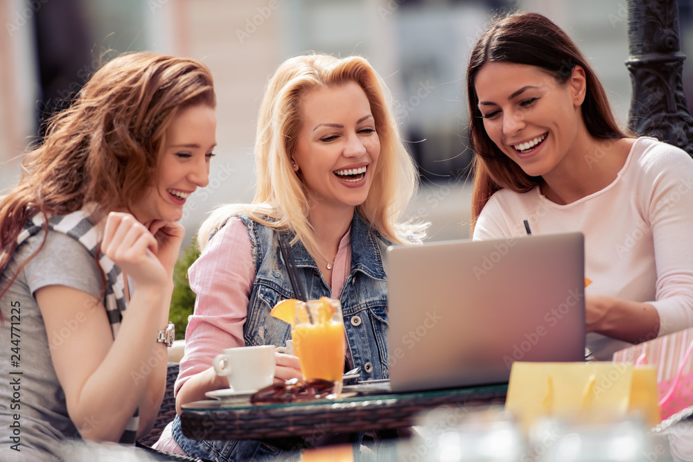 Female friends having fun in cafe Female friends having fun in cafe
