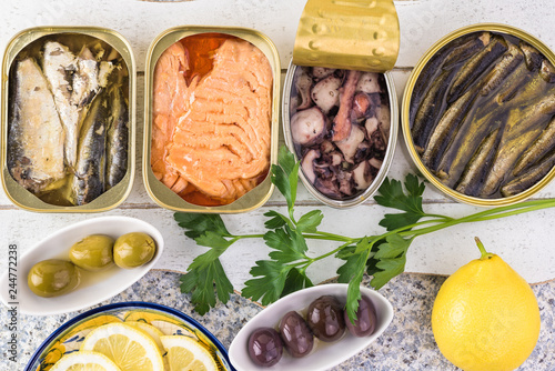 Varieties of canned fish. photo