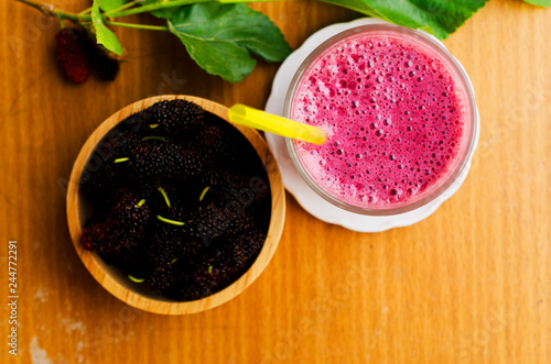Homemade smoothies mulberries yogurt drink on wood backgrounds above