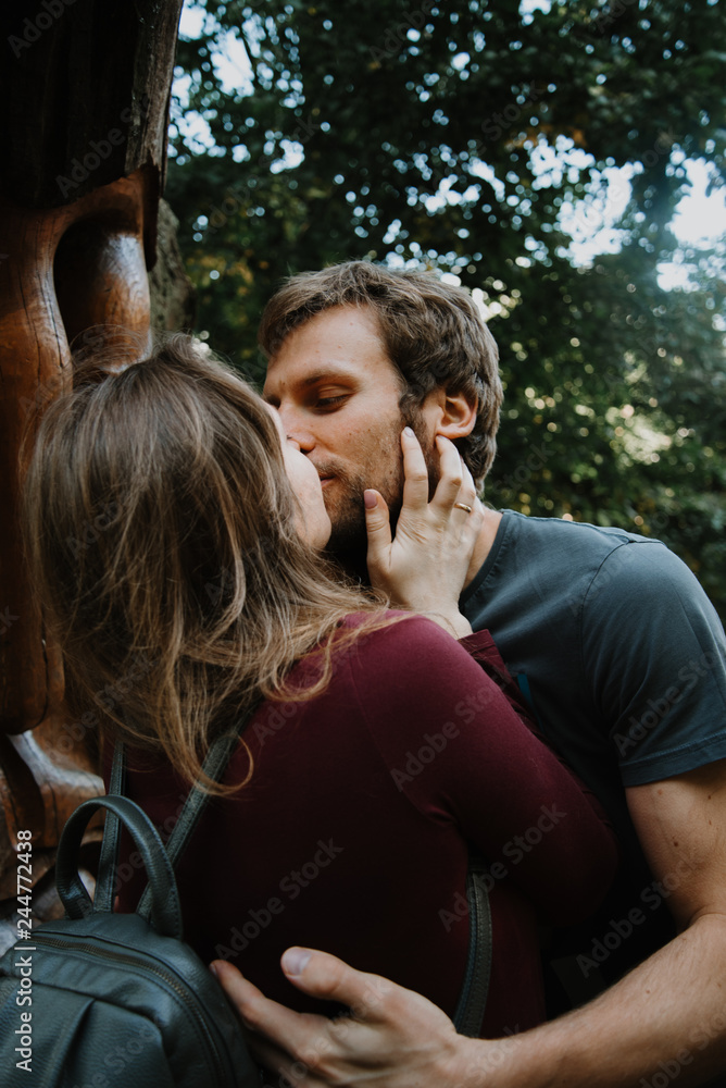 Fototapeta premium love story. stroll. beloved family and dog. future mom and dad. Pregant woman