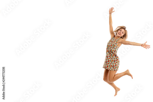 Cute young woman in a jump, isolated on white background, copy space