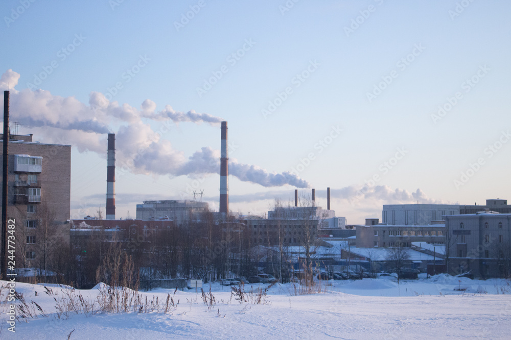 urban winter landscape. smoke from the chimneys