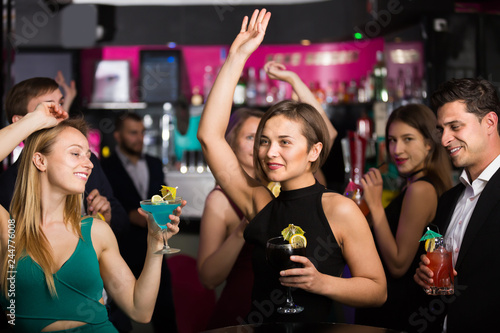 Young colleagues dancing on corporate party