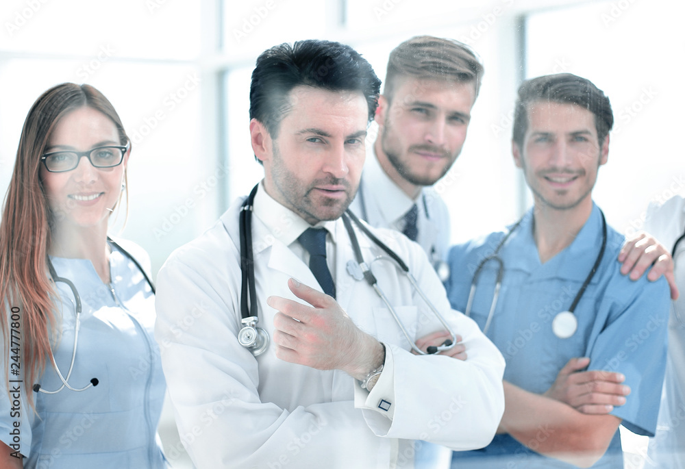 group of doctors standing in the meeting room group of doctors standing in the meeting room