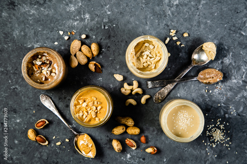 Bild auf Leinwand Selection of nut butters - peanut, cashew, almond and sesame seeds, copy space